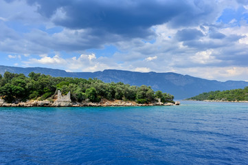 Beautiful seascape with island and the ruins of the old building