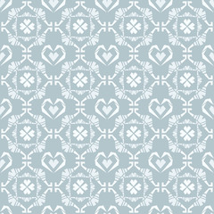 Seamless doodle heart pattern in blue background
