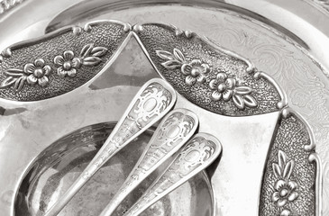 vintage old silverware in a silver tray  close-up