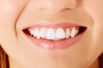 Healthy woman teeth and smile. Isolated over white.