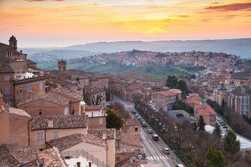 Small Italian town Fermo under brignt morning sky