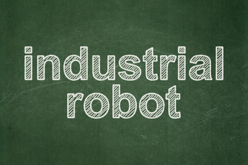 Obraz premium Industry concept: Industrial Robot on chalkboard background