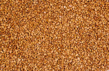 Light brown crystals  of the instant coffee - food background