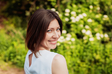 Fototapeta premium beautiful young woman smiling in the park
