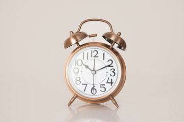 Retro alarm clock on a plain background closeup
