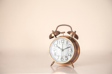 Retro alarm clock on a plain background closeup