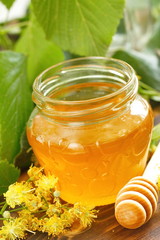 Linden honey in glass jar