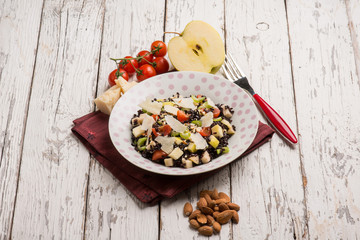 black rice salad with tomatoes apple almond and parmesan cheese