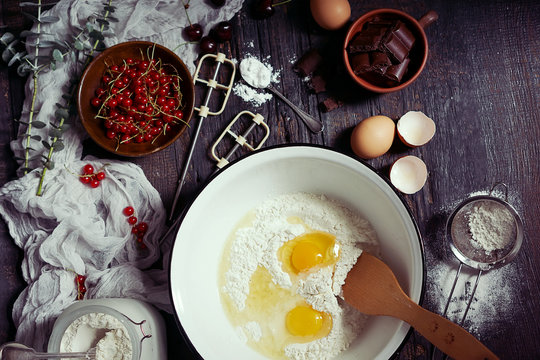 Ingredients For Fruit And Chocolate Cake In Rustic Kitchen