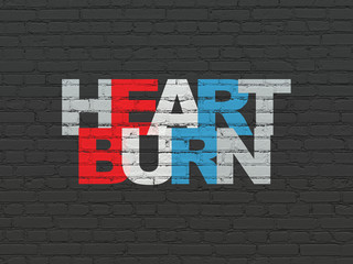 Health concept: Heartburn on wall background