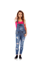 Young happy woman showing thumb up