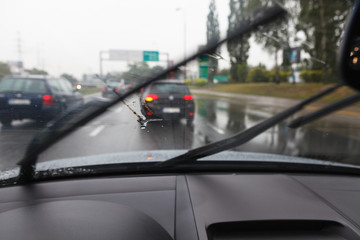 Driving a car in bad weather conditions in traffic jam - blurred view