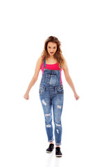 Angry screaming young woman with clenched fist