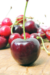 Cherries on wooden background