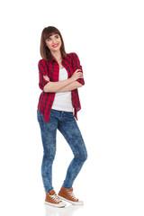 Smiling Girl In Lumberjack Shirt With Arms Crossed