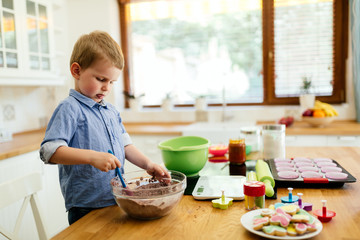 Cute child learning to become a chef
