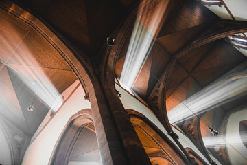 light shafts stream into church window