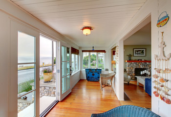 Entrance room with hardwood floor connected with living room.