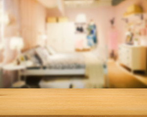 wooden counter with bedroom background