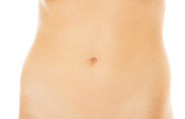 Fototapeta na wymiar Slim beautiful nude woman's belly