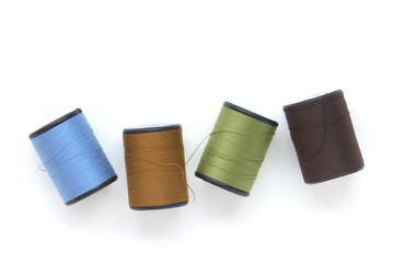 beautiful colors of thread on white background