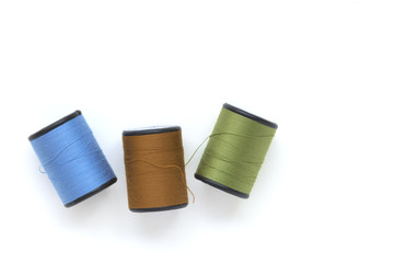 beautiful colors of thread on white background