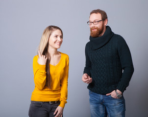 Young woman and a young man in the studio