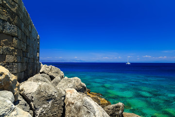 Fort Rhodes view from sea and stone sunny day