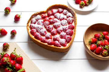 gift on Valentine's Day. Cheesecake in a heart shape. View from above