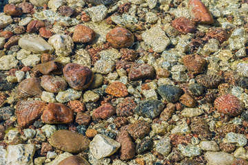 Rocky sea bed through transparent water