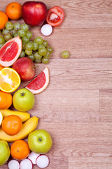 Fresh fruits on wooden background