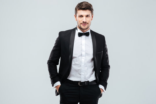 Confident young man in tuxedo with bowtie