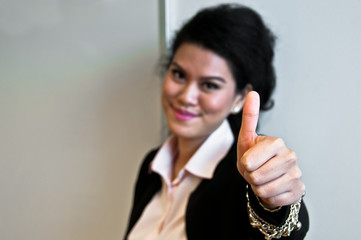 Business woman give thumb up on white background