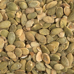 Close view of organic dry roasted pumpkin seeds.