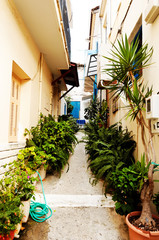 Fototapeta na wymiar Narrow street in Parga town, northwest of Greece, September 2014