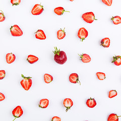 Colorful pattern of juicy strawberry halves on a white background.