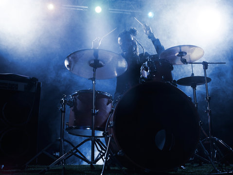 Silhouette drummer on stage.
