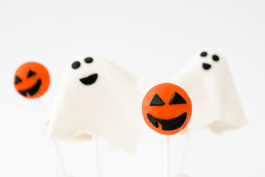 Halloween cake pops with phantom and pumpkin shape isolated on white background

