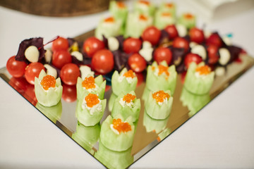 Red caviar, cherry on a plate