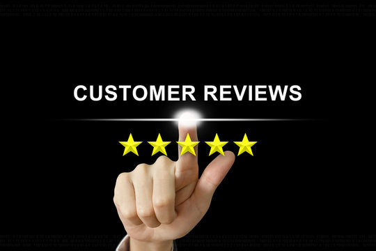 business hand pushing customer reviews on screen