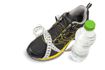 Sport shoes, measuring tape and a water bottle