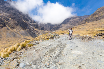 Fototapeta na wymiar Backpacker mountaineer walking posing mountain trail, El Choro t