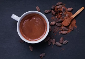Foto op Plexiglas Hot chocolate in a cup on the black background © Diana Vyshniakova