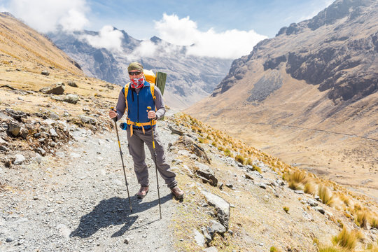Backpacker mountaineer standing posing mountain trail, El Choro