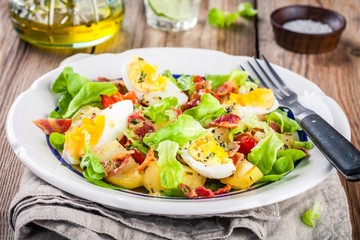 potato salad with eggs, lettuce,  tomatoes and bacon