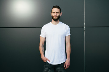 Hipster wearing white blank t-shirt with space for your logo