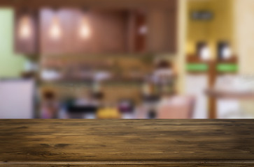 Selected focus empty brown wooden table and space of Coffee shop