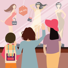 Obraz premium woman and kids standing in front of sale item fashion store
