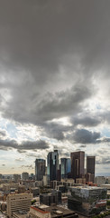 Downtown Los Angeles skyline with dark clouds