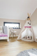Child attic bedroom with a wigwam tent